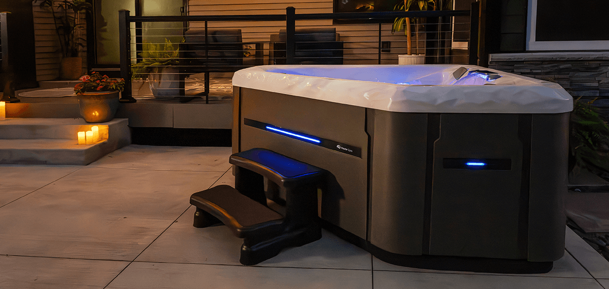 Backyard hot tub installation with outdoor seating